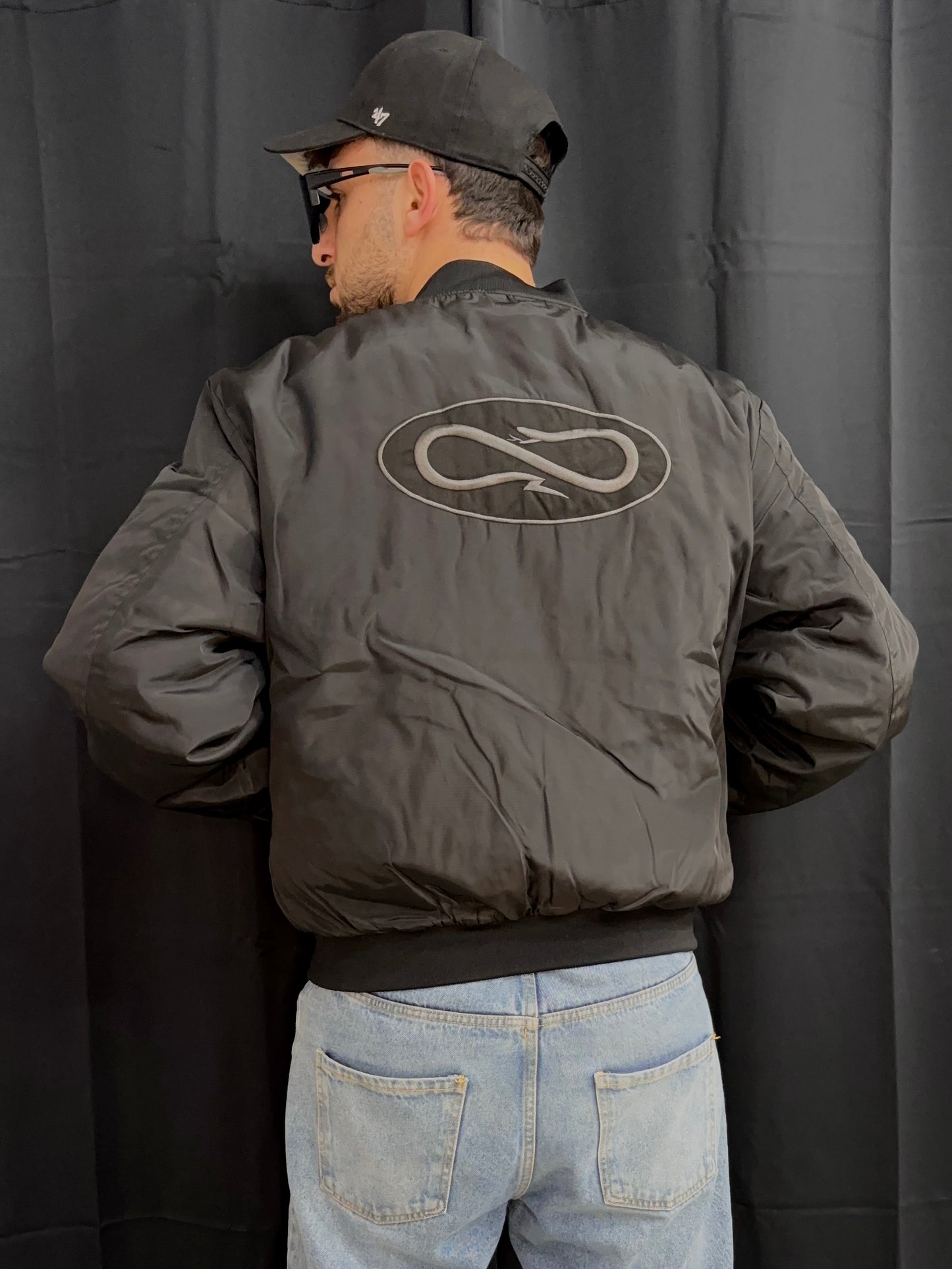 Bomber jacket logo atom